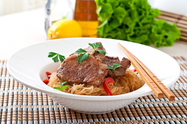 Pork medallions in oyster sauce with noodles