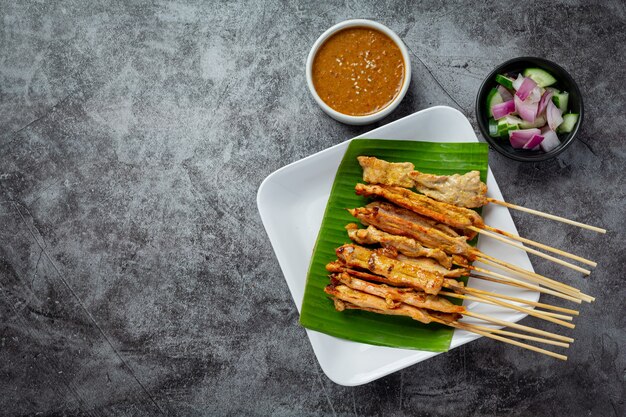 Pork satay with peanut sauce or sweet and sour sauce, Thai food