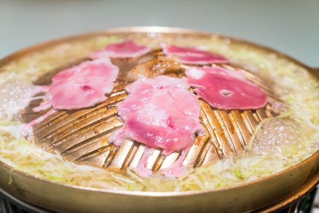 pork sliced grilling on hot pan