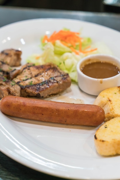 Pork steak with sausage