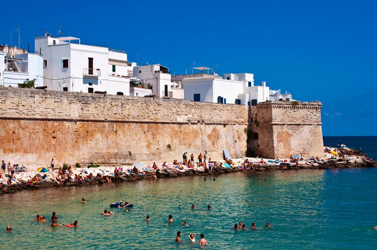 Port city with people on the rocks