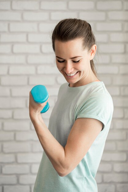 Portrait of active woman exercising at home