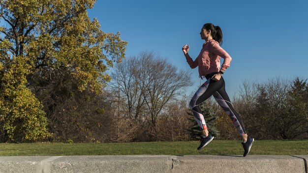 Portrait of active woman running outdoor