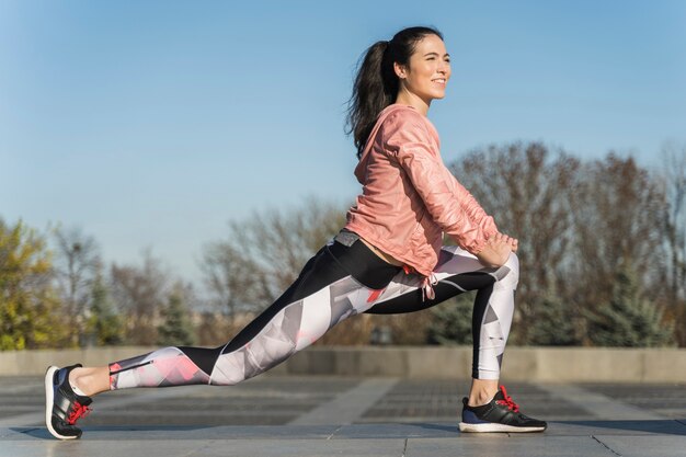 Portrait of active woman stretching