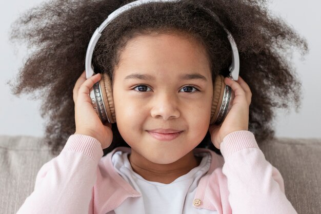 Portrait of adorable young girl with headphones