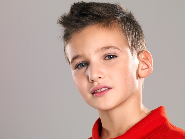 Portrait of an adorable young happy boy looking at camera