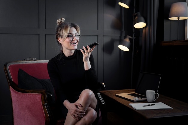 Portrait of adult businesswoman talking on the phone