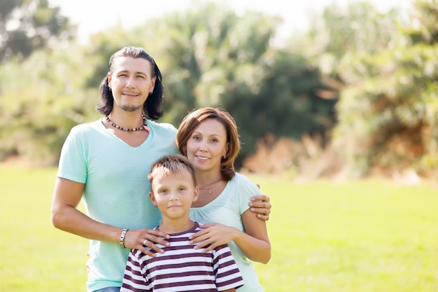 Portrait of adult couple with teenage son