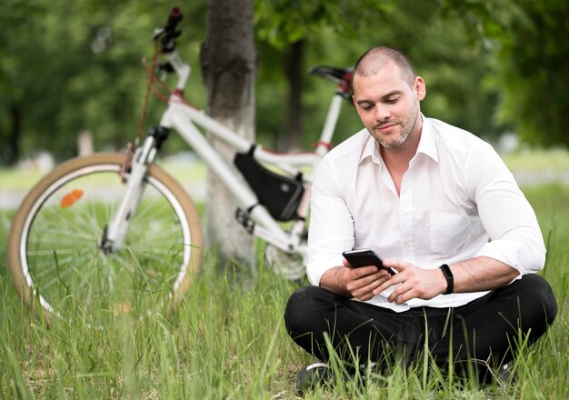 Portrait of adult male browsing mobile phone