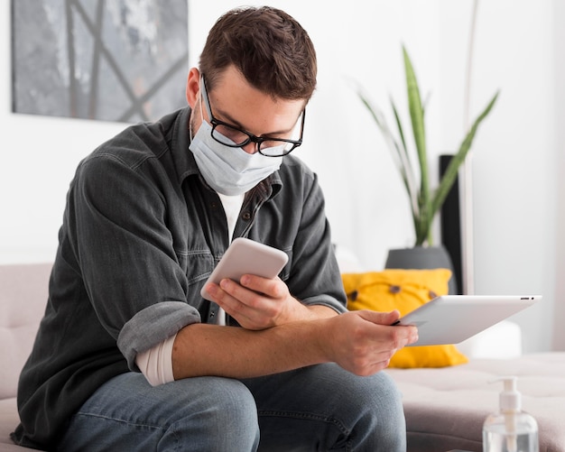 Portrait of adult male browsing mobile phone