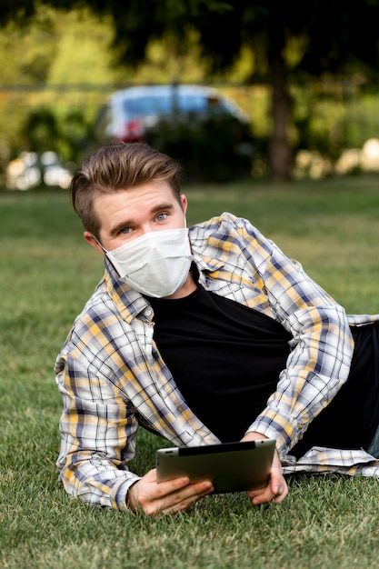 Free photo portrait of adult male posing with face mask