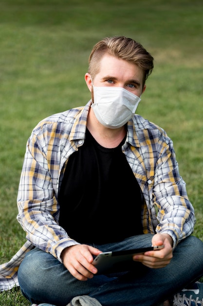 Free photo portrait of adult male posing with face mask