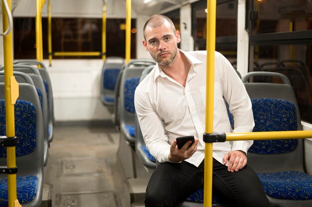 Portrait of adult male riding bus