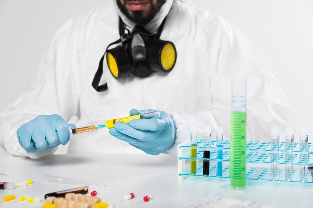 Portrait of adult male taking medical samples