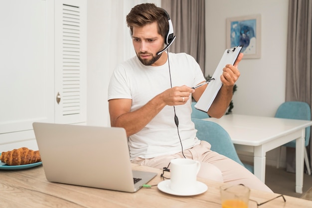 Portrait of adult male video conferencing