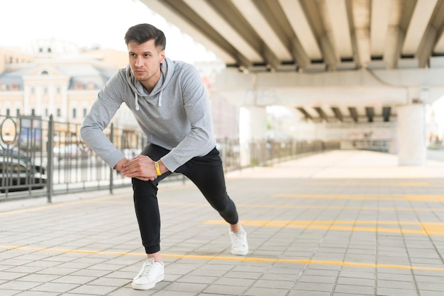 Free photo portrait of adult male warming up outdoors