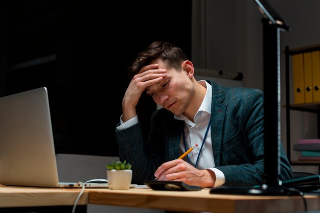 Portrait of adult male working from home at night