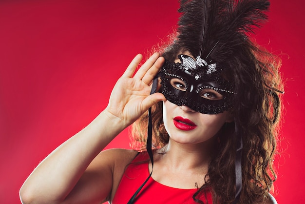 Portrait of adult woman in black mask