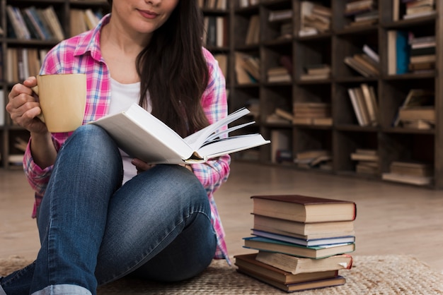 Portrait of adult woman reading a novel