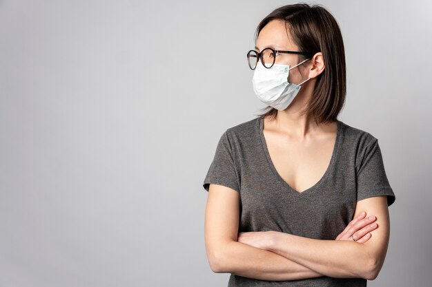 Portrait of adult woman wearing surgical mask