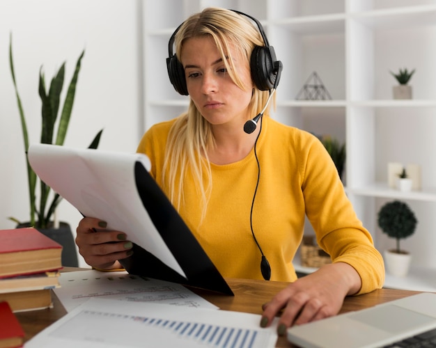 Free photo portrait of adult woman working from home