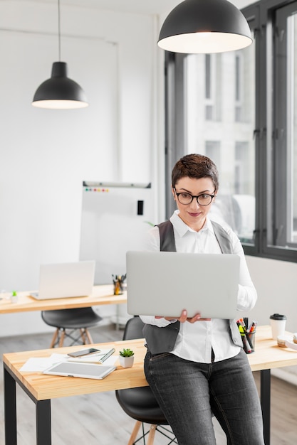 Portrait of adult woman working on laptop