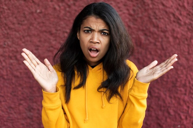 Portrait of african american woman looking shocked