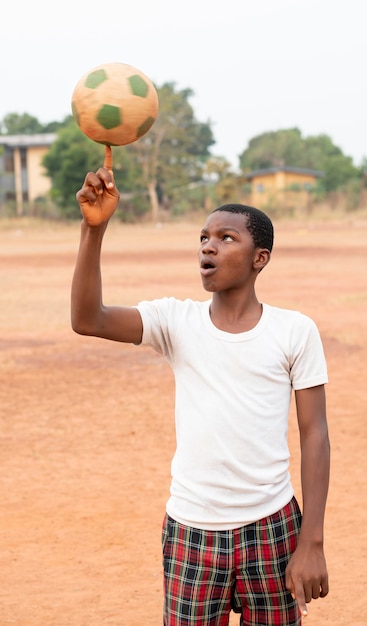 Portrait african child with football ball