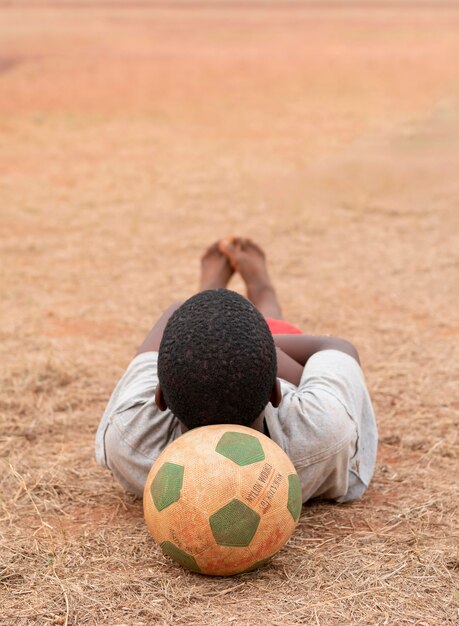 Portrait african child with football ball