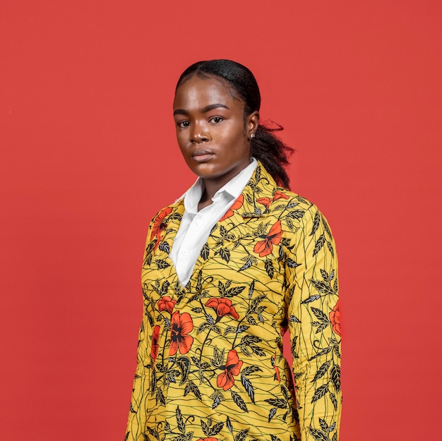 Portrait of african woman in floral coat