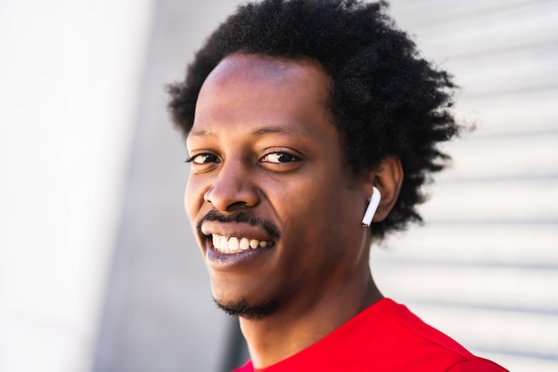 Portrait of afro athlete man standing outdoors on the street. Sport and healthy lifestyle.