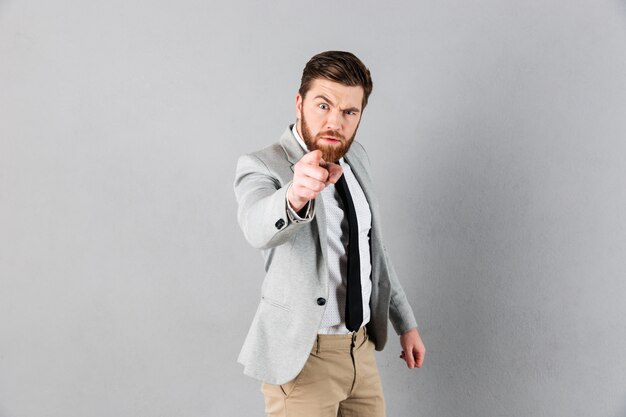 Portrait of an angry businessman dressed in suit