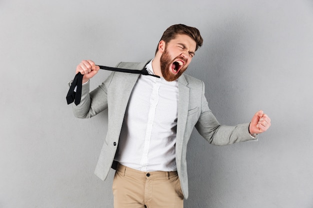 Portrait of an angry businessman dressed in suit