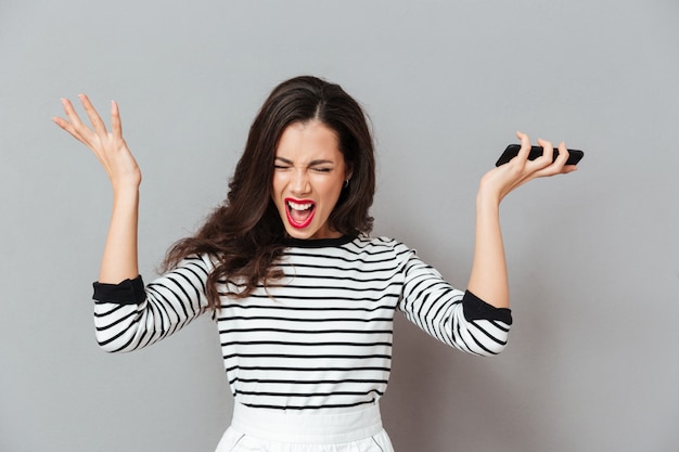 Portrait of an angry woman screaming