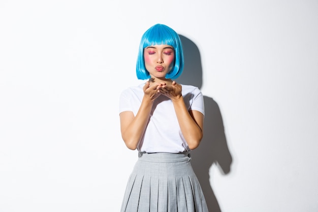 Portrait of an Asian girl in a blue short wig