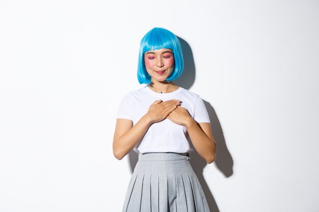 Portrait of an Asian girl in a blue short wig