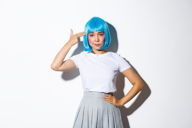 Portrait of an Asian girl in a blue short wig