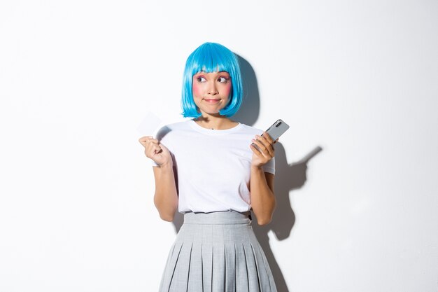 Portrait of an Asian girl in a blue short wig