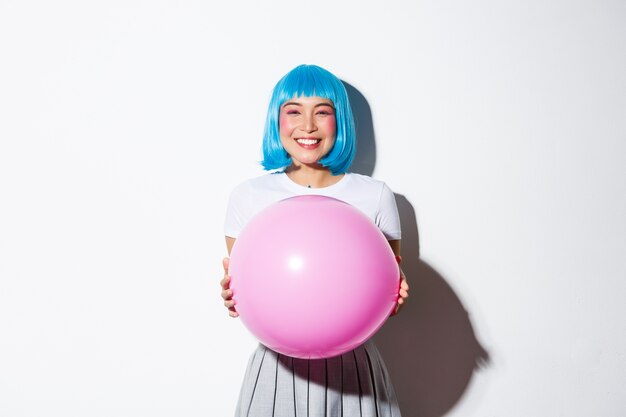 Portrait of an Asian girl in a blue short wig