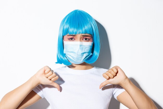 Free photo portrait of an asian girl in a blue short wig