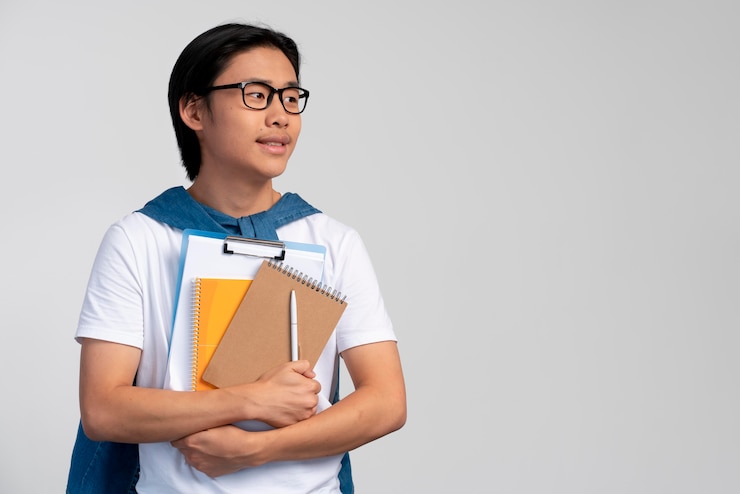 Free Photo portrait of asian teen boy ready for school