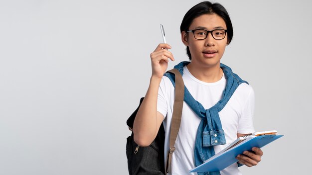 Portrait of asian teen boy ready for school