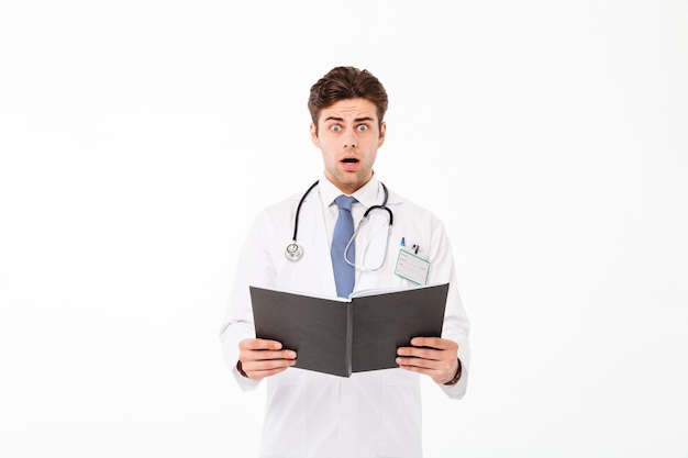 Portrait of an astonished young male doctor