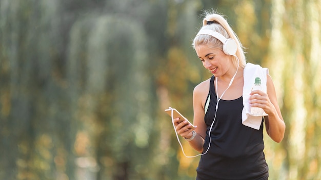 Portrait of athletic blonde woman with copy space