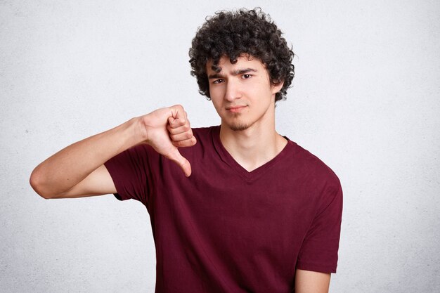 Portrait of attractive handsome male with curly hair