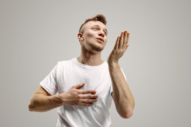 Portrait of attractive man blowing kiss