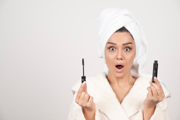 Free photo portrait of attractive woman wrapped in white towel .