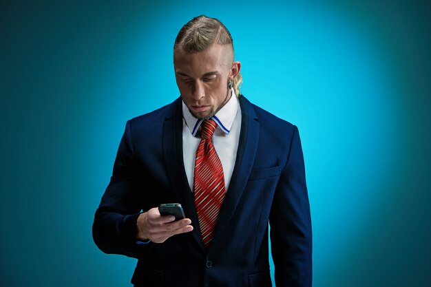 Portrait of an attractive young businessman wearing black suit