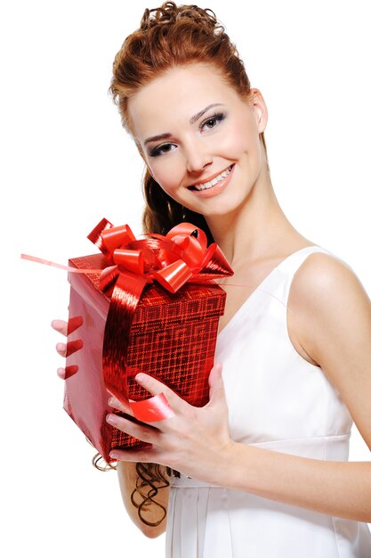 Portrait of an attractive young female holding present