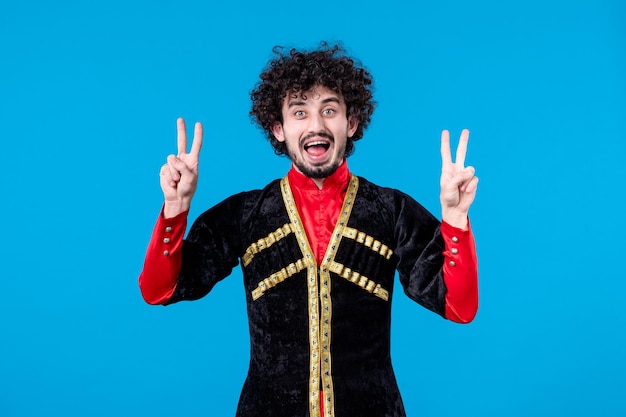 Portrait of azeri man in traditional costume studio shot blue background concept ethnic novruz